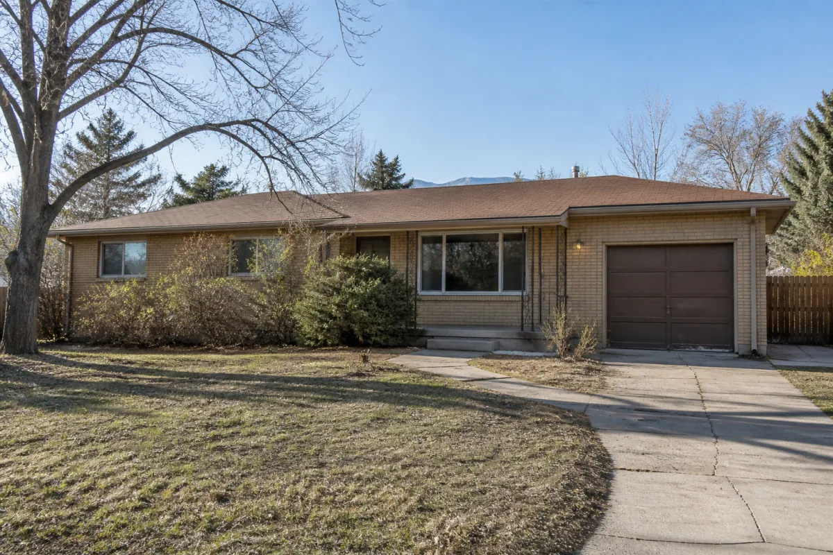 Dated tan-brick Denver ranch before exterior renovation